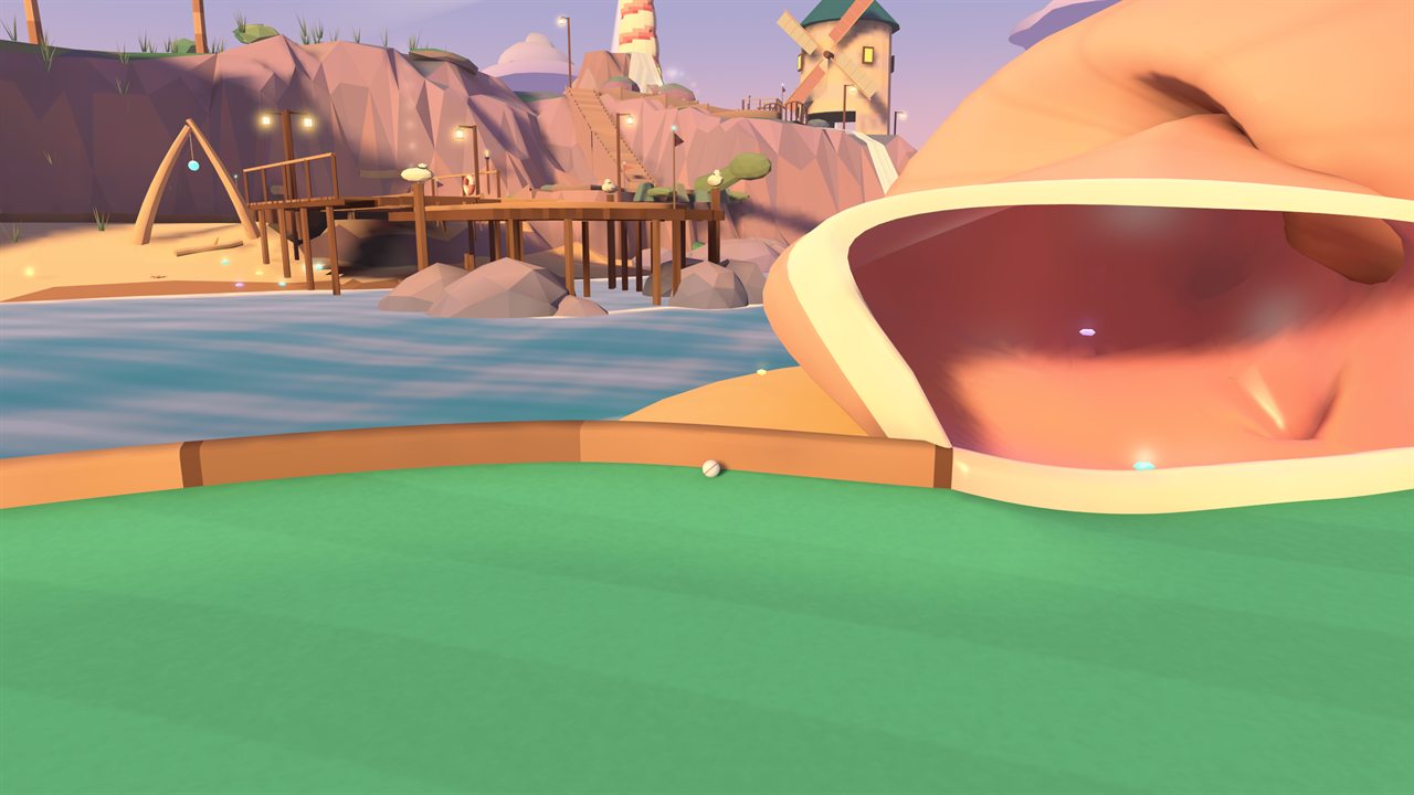 A golf ball rides the rail past the mouth of a giant conch shell