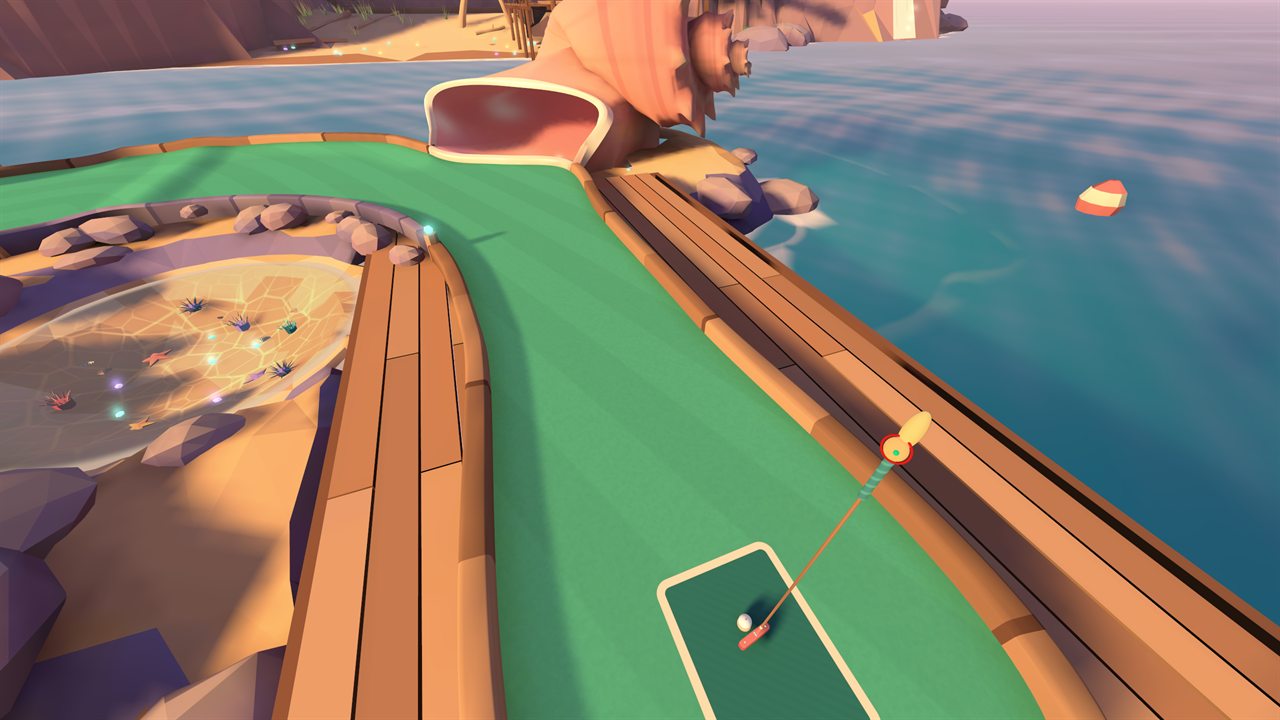 First-person view of the blade putter behind the ball on the first tee